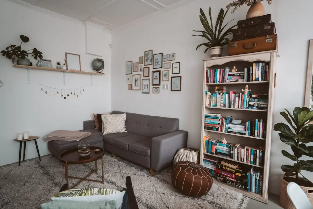 Photo Of Bookshelves Near Grey Couch